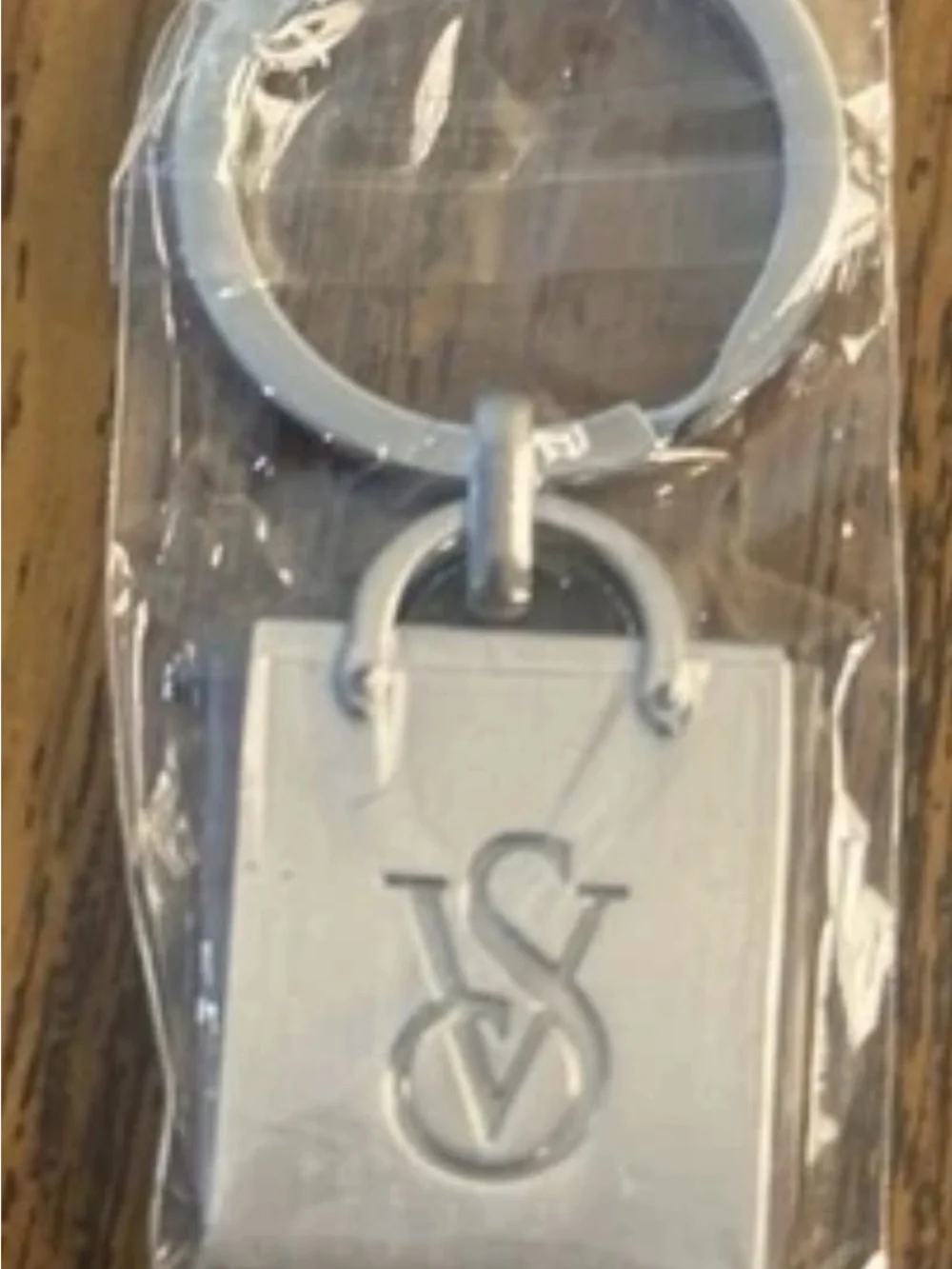 Victoria's Secret stainless steel keychain with a laser-cut VS logo
